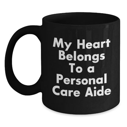 Cute Personal Care Aide Gifts from Men to Women, Unique Birthday Unique Gifts for Personal Care Aide, Funny Black Coffee Mug, 'My Heart Belongs To A Personal Care Aide' - Main