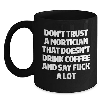 Funny Mortician Christmas Unique Gifts from Friends for Men, Women, Coworkers, Family - 'Don't Trust A Mortician That Doesn't Drink Coffee And Say F--k A Lot' Black Coffee Mug - Main