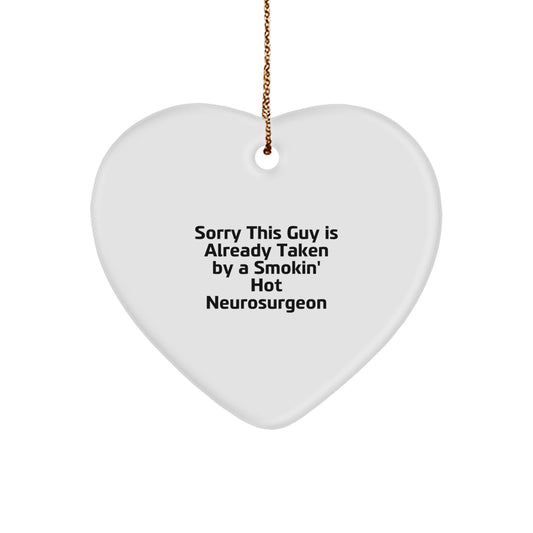 Funny Neurosurgeon Gifts from Friends for Christmas - Heart Ornament with 'Sorry This Guy Is Already Taken By A Smokin' Hot Neurosurgeon' Quote - Image 1